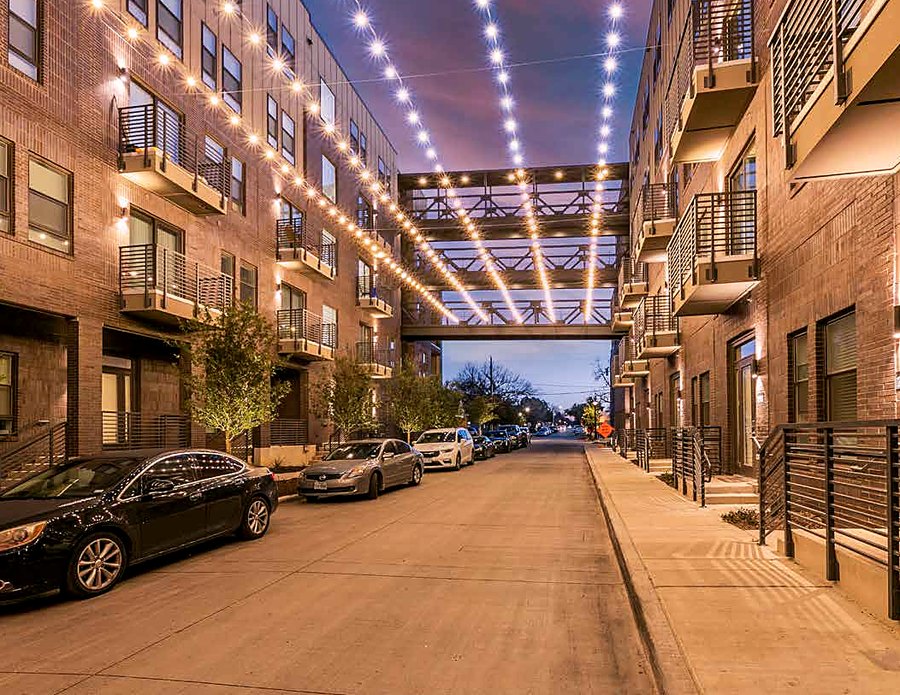 String-lit breezeway walkway at The Cooper apartments